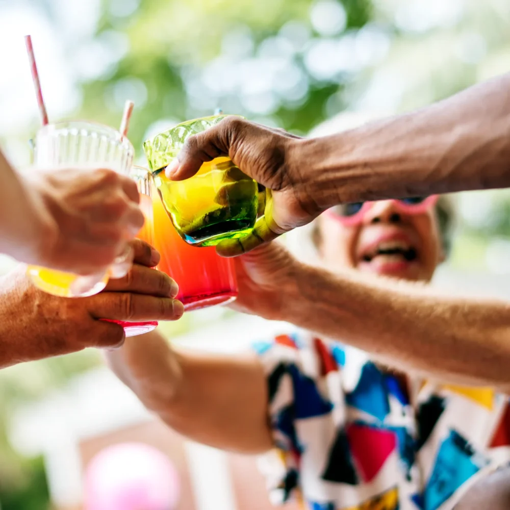 group-diverse-senior-adult-enjoying-beverage-by-pool-together